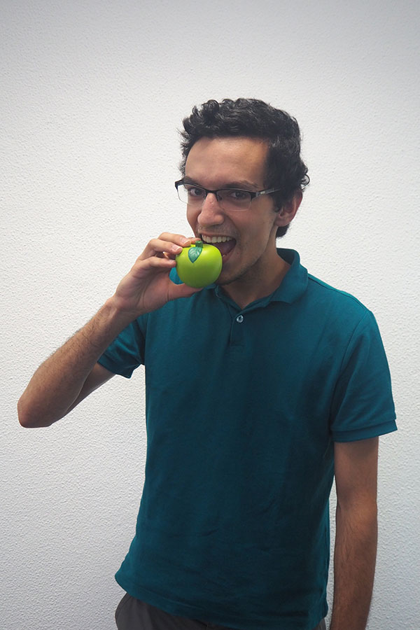 Man biting an apple